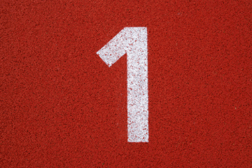 Three photos of running-track lane numbers animating in sequence: 1, 2, 3